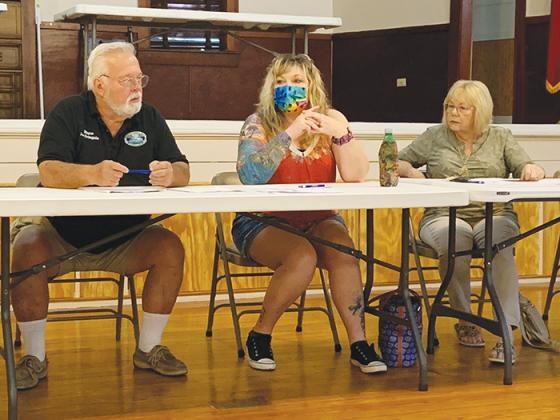 From left, Pomona Park Mayor Joe Svingala and council members CarrieAnn Evans and Lynda Linkswiler listen during a Saturday special meeting at the town’s community center as residents suggest projects the town could undertake using a $460,000 grant from the American Rescue Plan Act.