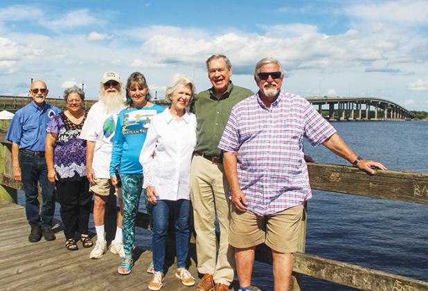 Bartram Trail Society of Florida members stand against a backdrop of the St. Johns River and Memorial Bridge on Monday, just four days ahead of the Bartram Frolic.