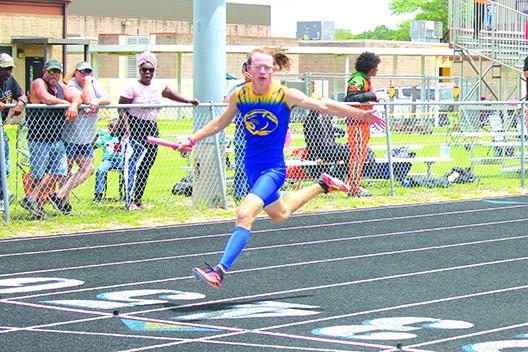 Palatka’s Hayden Newman looks at his team’s time after anchoring the winning boys 4x100 relay team. (MARK BLUMENTHAL / Palatka Daily News)