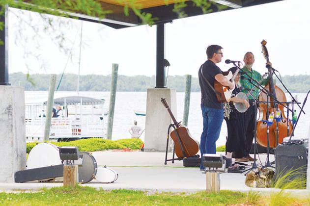 The band Gatorbone plays for people attending the Bartram Frolic on Saturday at the Palatka riverfront.
