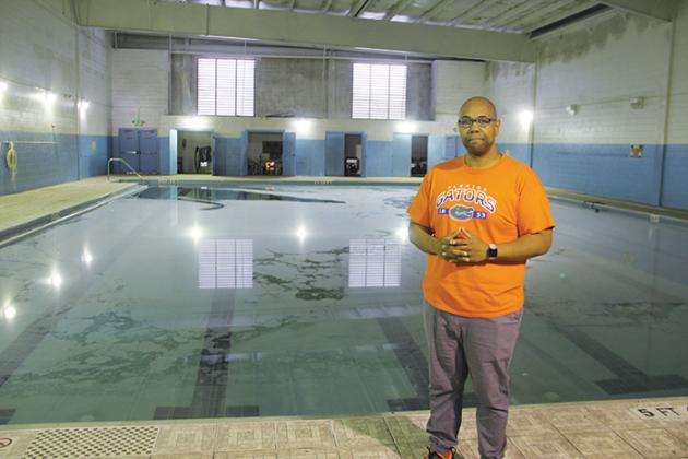 The Rev. Herbert Johnson stands in front of the Family Life Center’s pool earlier this month.