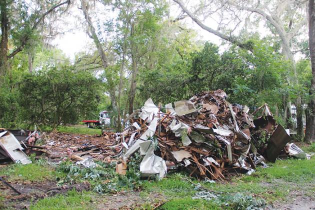 A pile of rubble towers over St. Johns Campground last week, leaving some residents worried their homes could be next. 