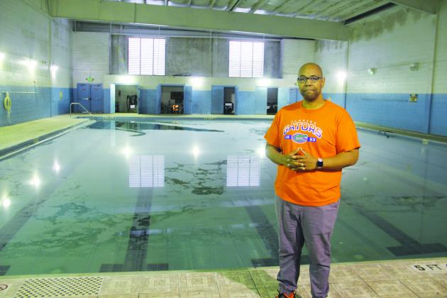 The Rev. Herbert Johnson stands next to the Family Life Center’s pool.