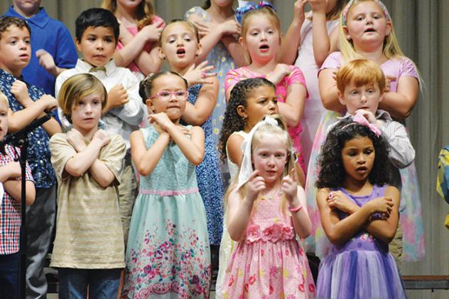 First graders at Robert H. Jenkins Elementary School in Interlachen perform the “Love You Forever” Mother’s Day Program on Thursday evening.