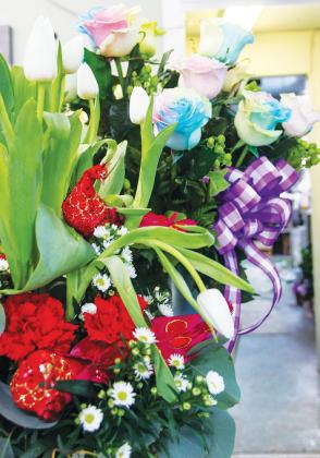 Mother’s Day flower arrangements sit on the counter at Palm Florist in Palatka on Thursday.
