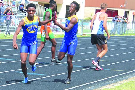 Palatka’s C’Ontrae Clark (right) hands the baton on to Tommy Offord during the 4x400 boys relay in the District 5-2A championship at Palatka Junior-Senior High School. Palatka’s 4x400 relay team will be last to compete at Thursday’s FHSAA 2A championship meet. (MARK BLUMENTHAL/ Palatka Daily News)