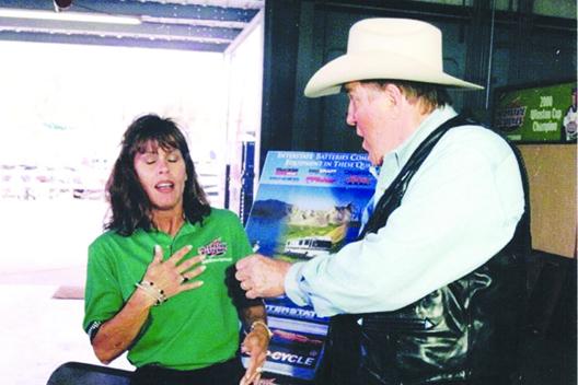 Ray Scott releases his life-like mouse to frighten a marine battery sales lady at Millers Boat Marine Outdoor Show years ago. (GREG WALKER / Daily News correspondent)