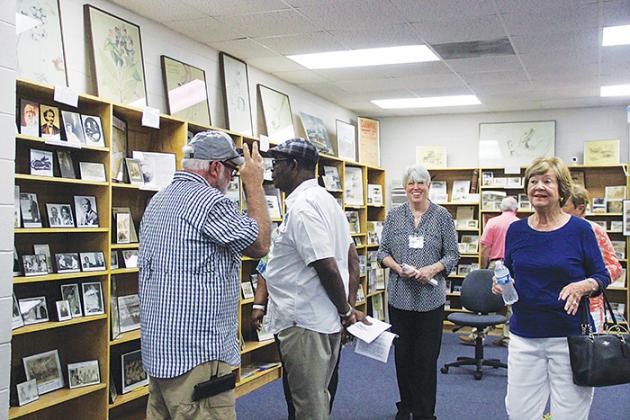 Guests admire the Margary Neal Jones Nelson Archives on Saturday at George C. Miller Middle School. 