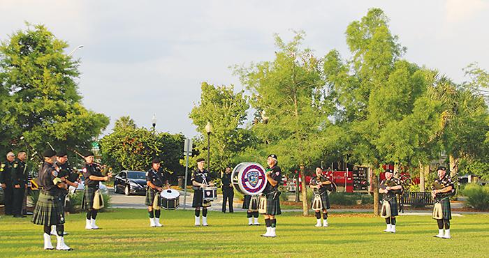 Bagpipe players perform “Amazing Grace” at a memorial service for fallen law enforcement officers Tuesday. 