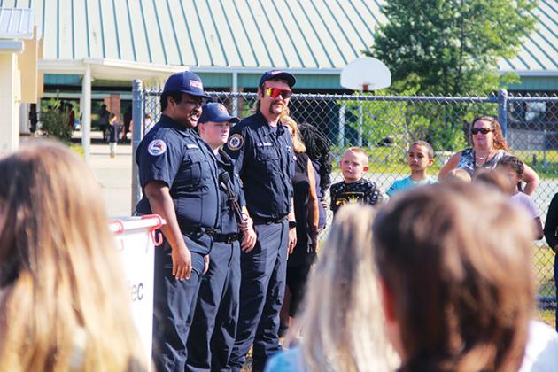 Putnam County Fire Rescue first responders, from left to right, Joshua Florence, Madison Yakel and Randall Adkins talk about their jobs with Ochwilla students.