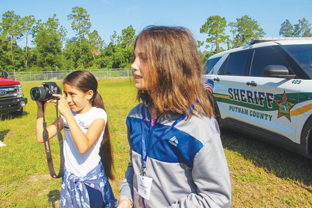 Ochwilla Elementary School students practice photojournalism and learn about news reporting from a Palatka Daily News reporter during the school’s career day Tuesday.