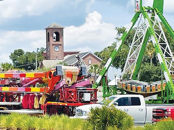 Carnival rides are being erected Wednesday in the city docks parking lot in preparation for this weekend’s Blue Crab Festival. 