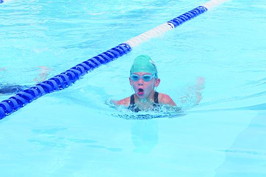 Putnam Sharks swimmer Presley Roberts swims her leg of the winning 8-and-under 100-yard medley relay Saturday at the Putnam Aquatic Center. (MARK BLUMENTHAL / Palatka Daily News)