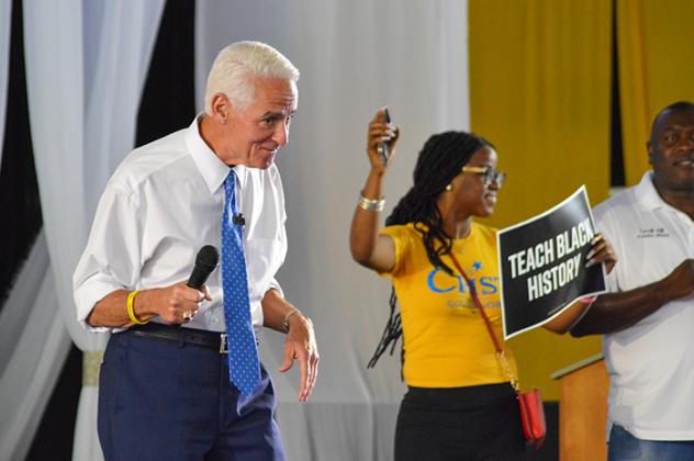 Former governor and current Democratic gubernatorial candidate Charlie Crist pumps up the crowd Saturday during Juneteenth celebrations in Palatka. 
