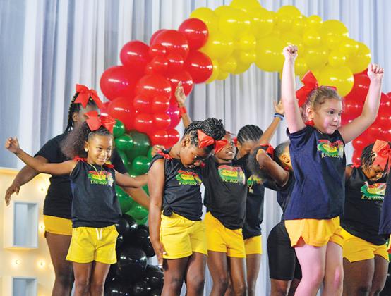 All Stars Sports and Athletics do a cheer routine during Juneteenth celebrations Saturday afternoon. 