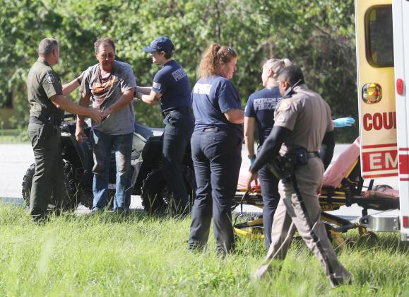 Putnam County Sheriff's Office. First responders attend to an injured pilot  following a crash landing Monday morning in the woods near the Palatka Municipal Airport.