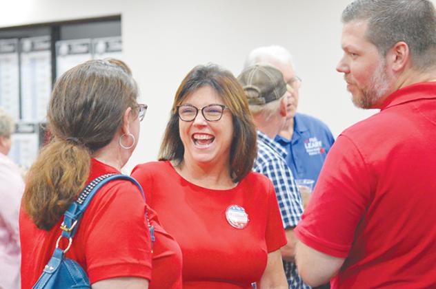 CASMIRA HARRISON/Palatka Daily News Leota Wilkinson, center, talks to Rhonda Williams, left, and David Parsons after the unofficial results from Tuesday’s primary were posted.