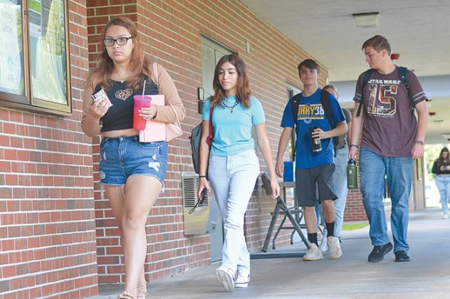 Students at St. Johns River State College traverse the Palatka campus as classes shift Wednesday morning.