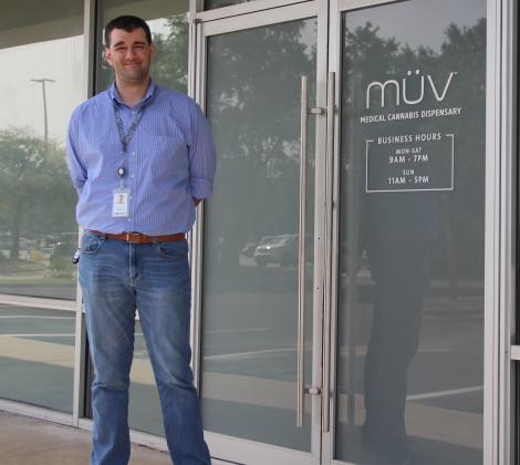 General Manager Ryan Killian stands outside MÜV Medical Cannabis Dispensary on Wednesday, the day after the store opened.
