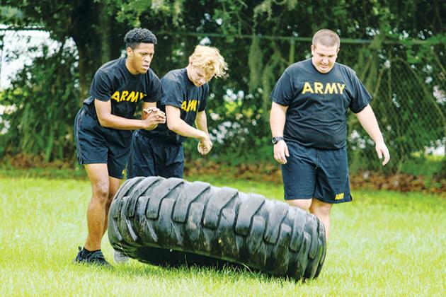 Interlachen Junior-Senior High School JROTC cadets push through tire flip exercises to get ready for competition season that begins Sept. 24.