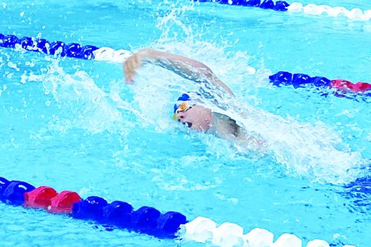 Palatka’s Grant Porch churns through the water during the 400-yard freestyle relay on Thursday against Yulee at the Putnam Aquatic Center. (COREY DAVIS / Palatka Daily News)