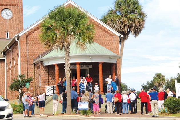 A crowd of residents stand outside First Presbyterian Church of Palatka to ring bells promptly at 4 p.m. Saturday in celebration of the 235th anniversary of the signing of the U.S. Constitution.