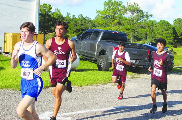 Peniel Baptist Academy standout runner Caleb Baker (left) is chased by Crescent City Junior-Senior High’s trio of (second from left) Jesus Cruz, Norberto Avila and Anthony Vazquez during last week’s Dwayne Cox Invitational at the West Putnam Recreation Center. (MARK BLUMENTHAL / Palatka Daily News)