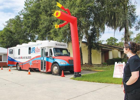 LifeSouth Community Blood Centers employee Amber Boynton watches the Bloodmobile pack up to head to Walmart in Palatka Friday morning. The team will be collecting blood donations over the weekend at 6003 Crill Ave. from 9 a.m. - 2 p.m. Saturday and 10 a.m. - 3 p.m. Sunday.