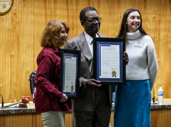 Photo by Sarah Cavacini/Palatka Daily News. Commissioner Judy West, and Vice Mayor Harry Banks smile Thursday evening after Eryn Russell (right) presented the two Crescent City public officials with awards for their decades of service. 