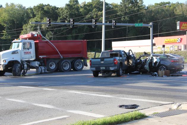 Vehicles block the intersection of State Road 207 and U.S. Highway 17 Tuesday morning after an East Palatka crash.