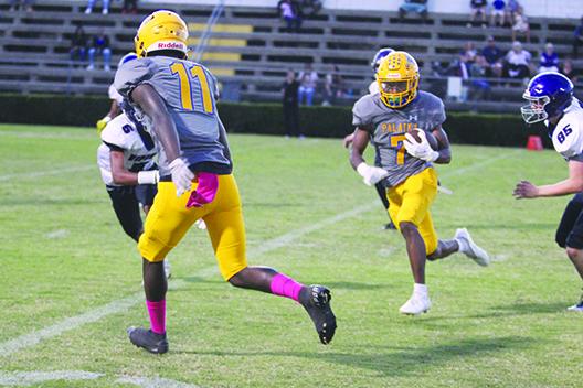 Palatka’s Ty’ran Bush marches down the field after catching a pass for 33 yards against Space Coast. At left is teammate Keymari Hall. (MARK BLUMENTHAL / Palatka Daily News)