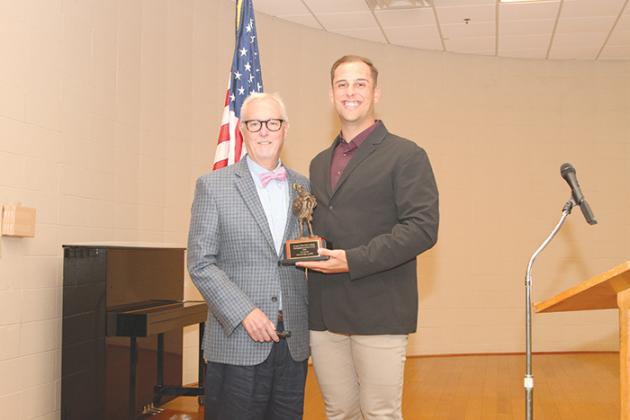Pickens hands off a Distinguished Alumni Award to Nathaniel Lowe, who plays professional baseball with the Texas Rangers.