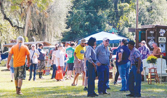 Festival-goers mingle and shop in Florahome during the town’s sixth Fall Heritage Festival on Saturday.