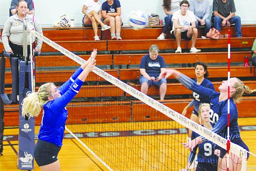 St. Johns River State College’s Cassidy Casey delivers a kill attempt against Florida State College-Jacksonville’s Marissa Hauser in the second of Wednesday’s match at Tuten Gymnasium. (MARK BLUMENTHAL / Palatka Daily News)