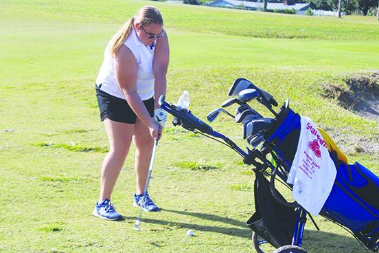 Palatka’s Mara Adams, the team’s lone senior starter, gets set to hit a shot on the 18th hole during Tuesday’s district meet. (MARK BLUMENTHAL / Palatka Daily News)