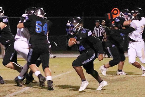 Interlachen’s Kendrick Chaney (24) follows the block of Zack Link for some of his 61 yards rushing in the Rams’ 46-0 victory over Daytona Beach Halifax Academy last Friday. (RITA FULLERTON / Special to the Daily News)