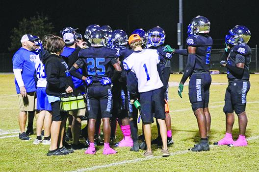 Interlachen coaches talk to the players during a timeout in Friday’s win over Daytona Beach Halifax Academy. (RITA FULLERTON / Special to the Daily News)