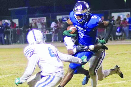 Interlachen’s Der’Tavius Mack catches a pass in between two Stanton defenders, including Tredian Tompkins (4) during the second half Friday night. (RITA FULLERTON / Special to the Daily News)