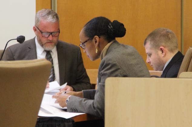 Mark Wilson Jr., right, who has been accused of murdering two boys in Melrose in 2020, sits with his defense team Monday morning.