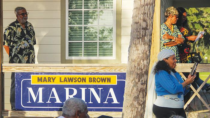 Guests take part in the marina dedication for Brown at Palatka riverfront on Saturday.