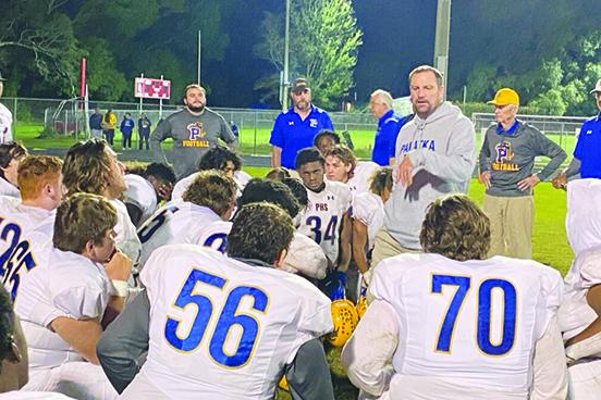 Palatka football coach Patrick Turner addresses his players after having their season end against Baldwin, 29-12, in the regional first round Saturday night. (COREY DAVIS / Palatka Daily News)
