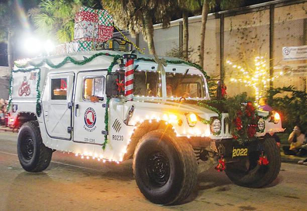 The Putnam County Sanitation Department lights up St. Johns Avenue in a decked out vehicle for the Christmas parade.