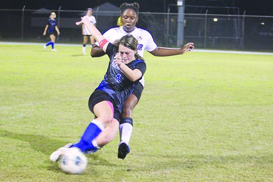 Interlachen’s Madisynn Guessford is taken down from behind by an unidentified Lake Weir player during Tuesday match. (MARK BLUMENTHAL / Palatka Daily News)