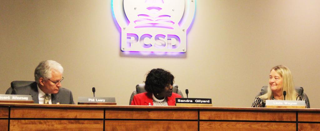 Sandra Gilyard, center - the newly appointed chair of the Putnam County School Board - addresses newly appointed Vice Chair Linda Wagner, right, at Tuesday's School Board meeting while School Board Member Phil Leary, left, listens.