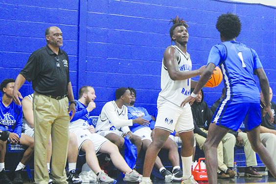 Interlachen coach C.S. Belton (left) watches Rams senior Justin Herring (1) try to find an open teammate while Clay’s J’den Golding covers him Monday night. (MARK BLUMENTHAL / Palatka Daily News)