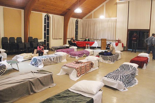 Residents settle in for the night Friday at the First Presbyterian Westminster Hall cold weather shelter in Palatka.