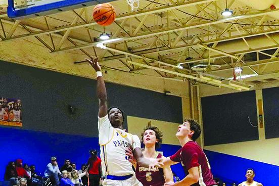 Palatka’s Trenton Williams goes up for a first-half shot against Jacksonville Episcopal School’s Declan McCarthy (5) and Grady Schwartz during Friday night’s game. (RITA FULLERTON / Special to the Daily News)