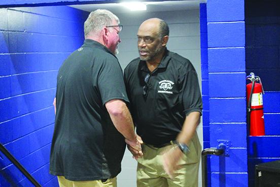 C.S. Belton is congratulated by Interlachen athletic director Ron Whitehurst after the Rams beat the Blue Devils, 51-44, for his 250th career win. (MARK BLUMENTHAL / Palatka Daily News)