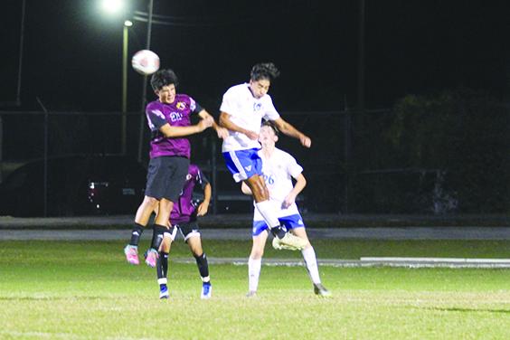Crescent City’s Jaasial Benitez (left) goes up for a headball against Palm Coast Matanzas’ Giancarlo Gonzalez during Tuesday night’s match. (MARK BLUMENTHAL / Palatka Daily News)