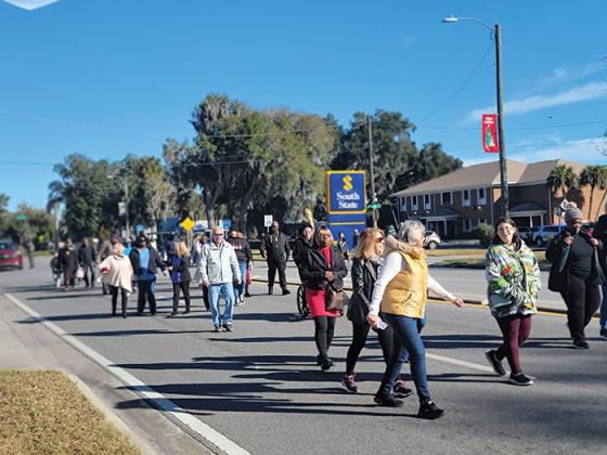 Crescent City residents and leaders march down Summit Street in honor of Martin Luther King Jr. Day.